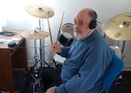 Wesley plays the drums