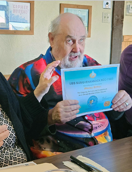 Wes Britton holds Appreciation Award